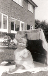 Angela Bayley in the sunshine as a baby